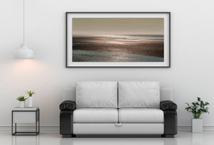 Alaska coastal seascape with shimmering water and distant brown bears