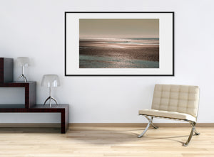 Calm Alaska shoreline photograph with distant brown bears and reflective water
