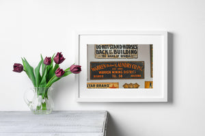 Old Arizona advertising signs with faded paint and texture