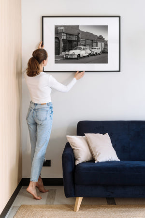 Historic Lowell Arizona streetscape with old vehicles and brick buildings