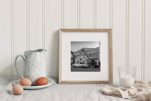Weathered brick building and vintage truck in Lowell Arizona street scene