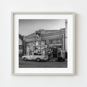 Vintage street scene in Lowell Arizona with old gas station signage black and white