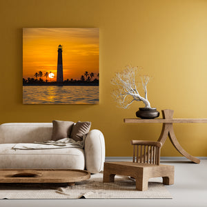 Warm sunset reflection on water near Dry Tortugas lighthouse