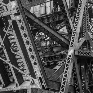 Riveted steel structure beneath abandoned railway bridge in Chicago