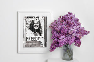 Black and white photograph of damaged freedom poster on city wall