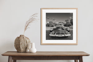 Vintage Chevrolet parked on grass in small town Illinois