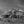 Large weathered Indiana farmhouse beneath dark clouds