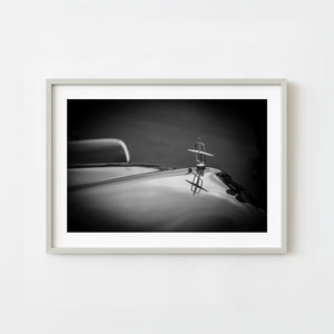 1959 Cadillac headlight and chrome bumper detail in monochrome