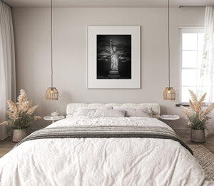 Nighttime close view of the Statue of Liberty in monochrome