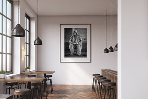 Street photography portrait of man holding book in NYC