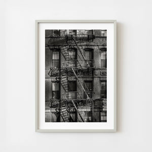 Black and white fire escape on brick apartment building in Manhattan