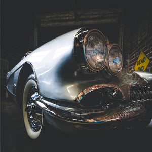 Classic 1960 Chevy Corvette twin headlights close perspective indoor museum