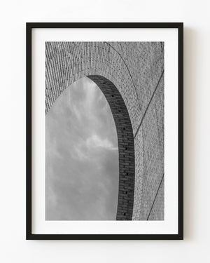 Black and white photograph of a brick arch at a historic Uruguay bullring