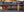 Colour panorama of a rustic Utah food mart beneath a rocky hillside