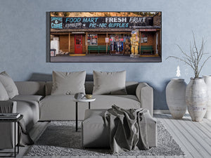 Wide view of an Americana storefront with log walls and faded advertising