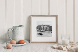 Venice waterway with a passenger vessel, small motorboat and historic facades