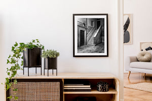 Light catches pale stone stairs between weathered walls in Venice