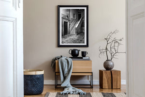 Black and white view of a quiet Venice doorway and exterior stone staircase