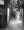 Passing people appear as soft motion trails between Venetian shop windows