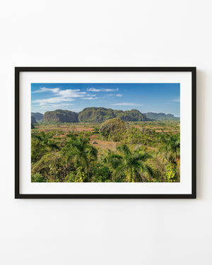 Green limestone hills and cultivated fields in Viñales, Cuba.