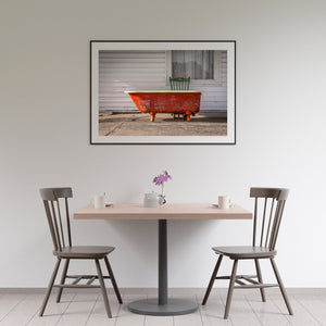 Side view of a vintage clawfoot bathtub, set against the backdrop of the iconic Route 66 scenery.