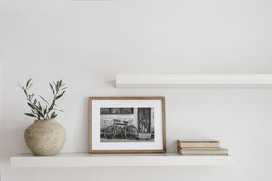 Monochrome Indian street detail with a bicycle and textured plaster wall