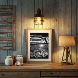 Reflective vintage car bodywork with a sharp antenna and shallow-focus background