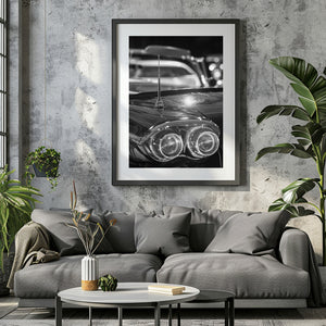 Chrome trim and twin tail lights form a soft foreground below a classic car antenna