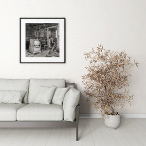 Monochrome photograph of a deserted Saskatchewan farmhouse room.