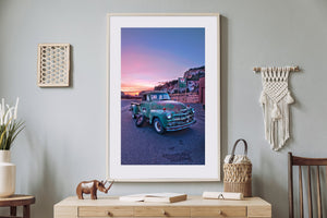 Rusted pickup truck on quiet desert roadside