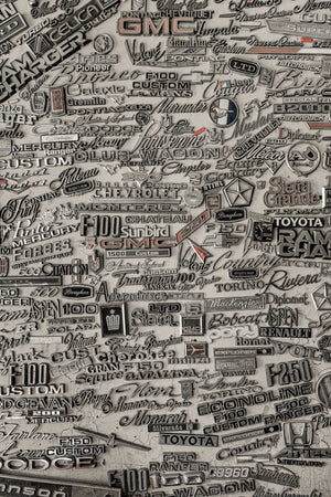 Collection of classic car nameplates and logos