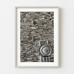 Vintage car emblems mounted on a wall in Halifax