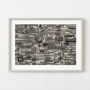 Vintage car emblems mounted on display wall