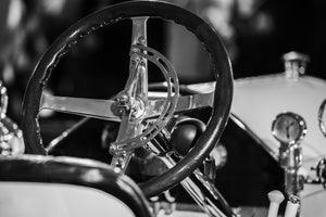 Vintage Cadillac interior with chrome steering wheel detail