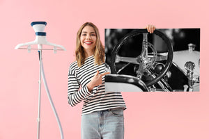 Monochrome vintage car interior with metal wheel spokes