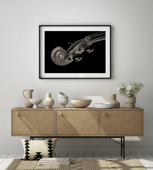 Artistic photograph of violin scroll and strings