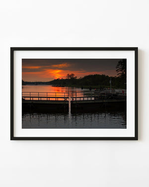 Orange sunset over Virginia Intracoastal Waterway locks.