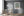 Rows of religious figures linked by decorative vines in a historic fresco.