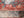 Scratched inscriptions over faded painted patterns at Voronet Monastery, Romania.