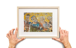 Colour photograph of historic painted figures on the Voronet Monastery wall.