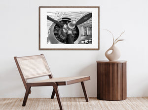 WWII aircraft nose and radial engine photographed in monochrome