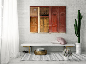 Stacked wooden doors on old building