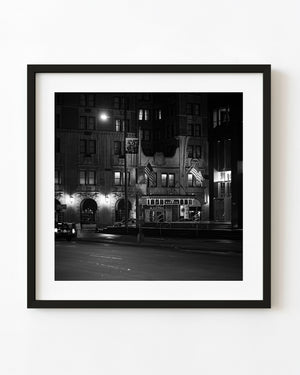 Warwick Hotel entrance in New York at night in black and white.