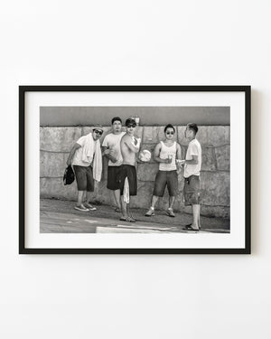Five men beside a stone wall at Wasaga Beach in black and white.