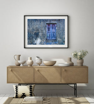 Blue and violet paint on a weathered wooden shutter