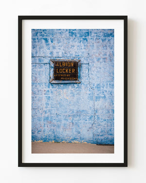 Vintage Albion Locker sign on a cracked blue wall