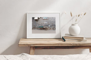 Weathered three-wheeled cargo bicycles with metal boxes