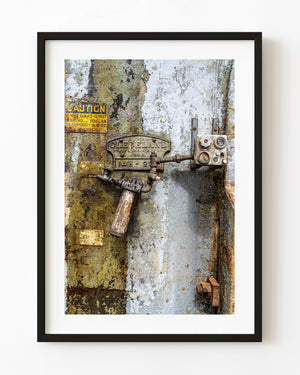 Weathered Cleveland punch and shear machine with peeling paint