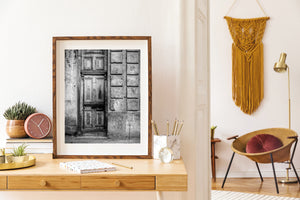 Black and white detail of a Cuban door and crumbling wall