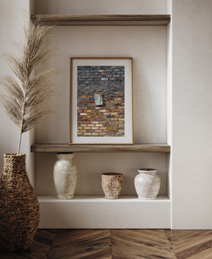Ochre and red bricks beneath dark staining in Dublin